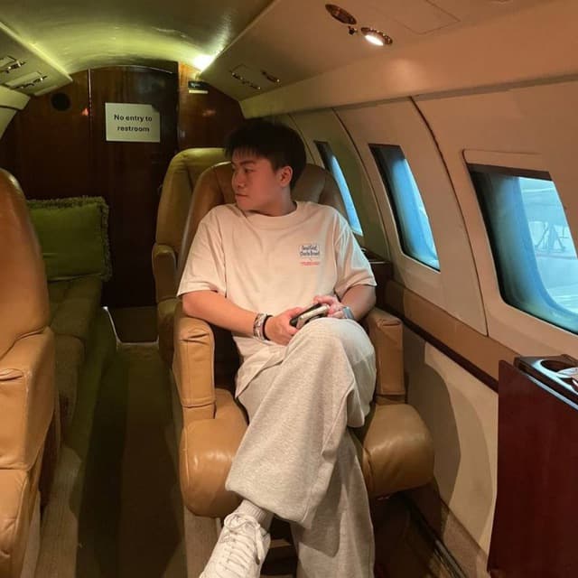 Alson seated inside an aircraft cabin